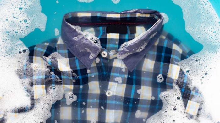 Shirt soak in powder detergent water dissolution. Laundry concept