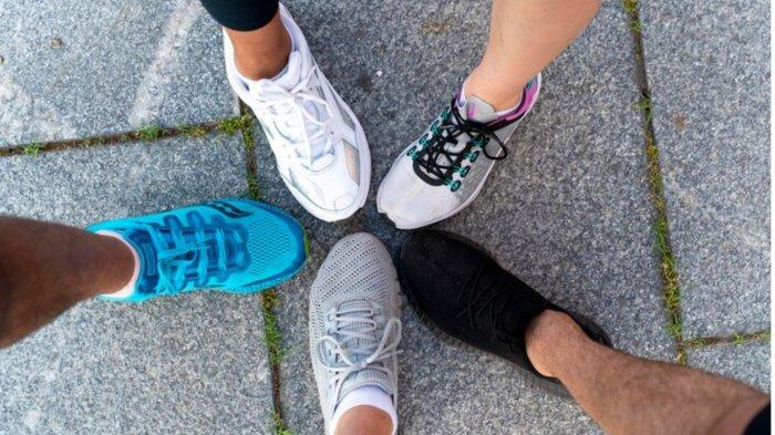 Close up legs wearing running shoes