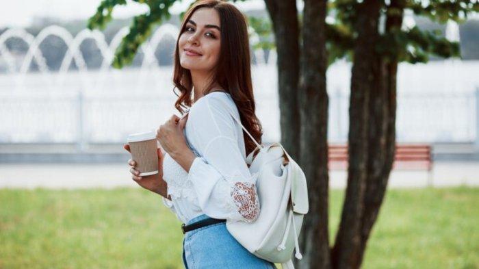 Young woman have good time in the park at her weekend