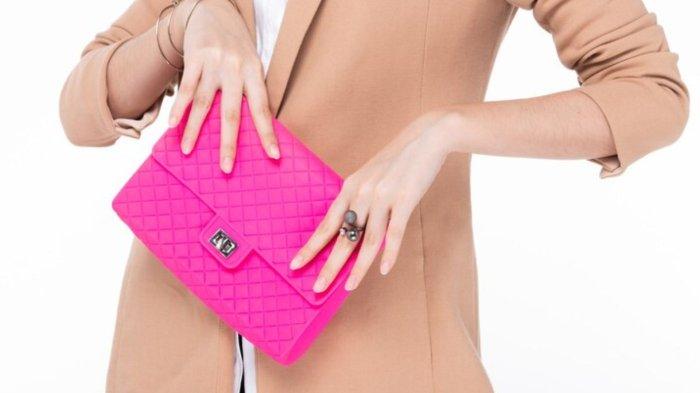 Female posing with pink purse