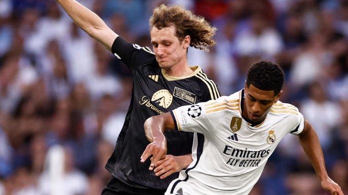 Duel gelandang Real Madrid Jude Bellingham dengan pemain Union Berlin di Liga Champions, Kamis (21/9/2023) dini hari WIB. (Twitter/@realmadrid)