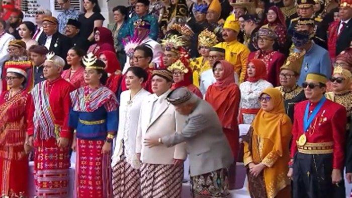 Viral aksi Menteri PUPR Basuki Hadimuljono saat periksa kantong baju Erick Thohir ketika Upacara HUT RI di Istana Merdeka, Kamis (17/8/2023) (Twitter/@BolaBolaAja)