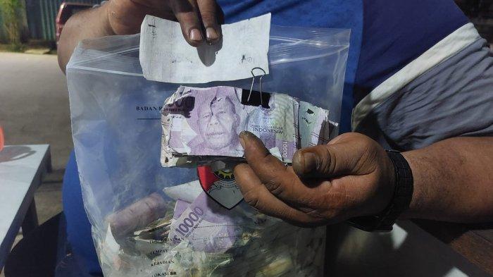 Inilah Rp700 ribu sisa potongan lembaran mata uang rupiah yang ditemukan dalam dekapan jasad di Samarinda dan tak bisa ditukarkan di BI
