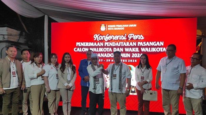Benny Parasan dan Bobby Daud memberikan keterangan kepada pers usai mendaftar di KPU Manado, Kamis (29/8/2024) malam.