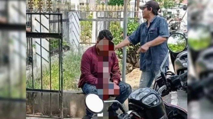 Korban (jaket merah) pasca penganiaan di halaman parkir Wisma Amawang.