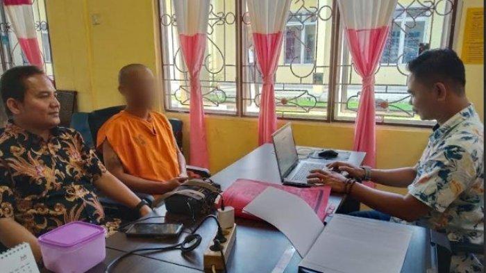 KASUS PENCABULAN: Seorang ayah bermarga Turnip alias TRT (41) jalani pemeriksaan di Polres Pematangsiantar, Kamis (29/5/2025) POLRES SIMALUNGUN.