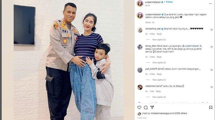 Pedangdut Uut Permatasari dengan kondisi hamil foto bersama dengan anak dan suaminya AKBP Tri Gofaruddin Pulungan.