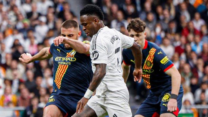 MENANG - Aksi penyerang Real Madrid, Vinicius Junior saat melewati pemain Girona. Dalam laga ini Real Madrid menang 2-0 atas Girona pada pekan ke-25 Liga Spanyol 2024-2025, Minggu (23/2/2025)