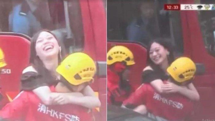 Wanita senang diselamatkan petugas damkar.