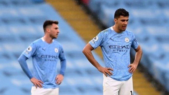 Ekspresi kecewa Aymeric Laporte (kiri) dan Rodri (kanan) pada laga pekan ke-35 Liga Inggris yang mempertemukan Man City vs Chelsea di Stadion Etihad pada Minggu (9/5/2021) dini hari WIB.