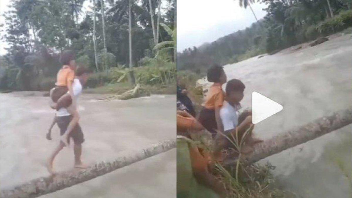 Para pria ini bantu Murid-murid SD seberangi sungai