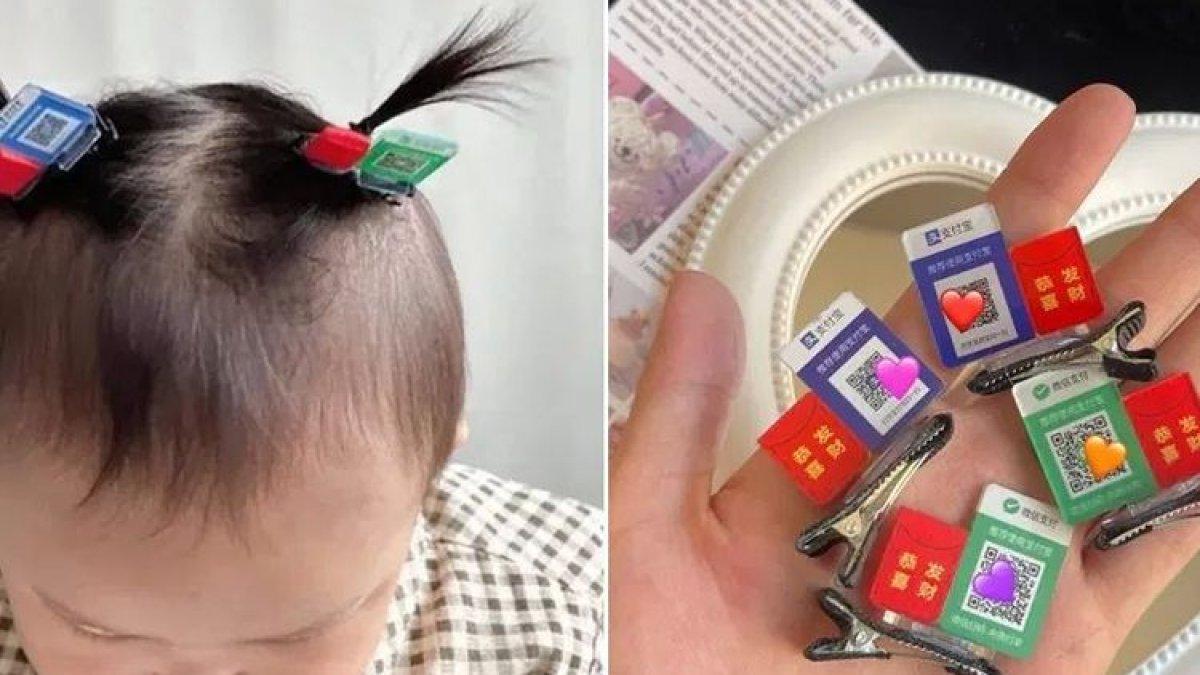 QR code yang dicetak di jepit rambut anak Vietnam untuk menerima angpau saat Tahun Baru Imlek 2024.