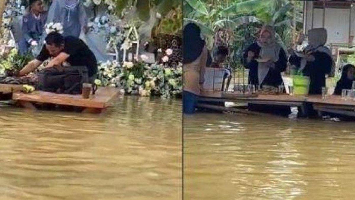Sebuah video memperlihatkan momen pesta pernikahan di tengah banjir beredar viral di media sosial.