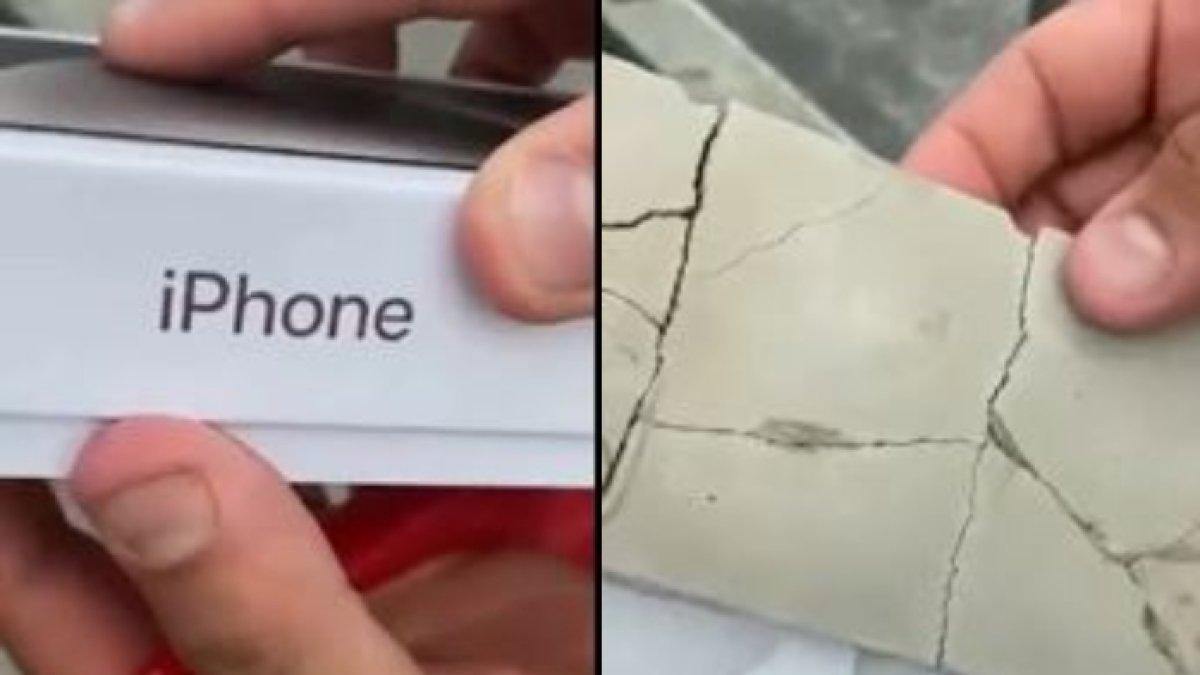 Seorang wanita gigit jari saat iPhone yang dia beli online yang datang adalah berupa tanah liat.