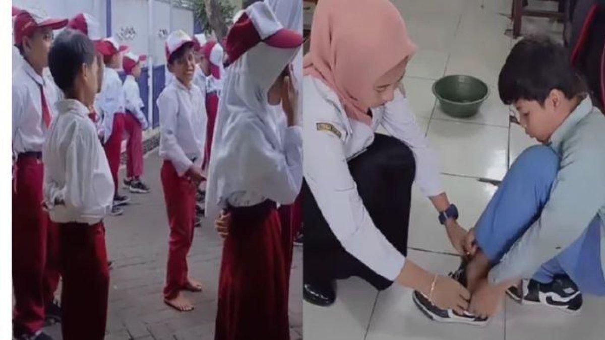 Siswa SD bernama Tomi tampak tak mengenakan alas kaki saat upacara bendera di sekolah. Kini, ia mendapat sepatu dari gurunya