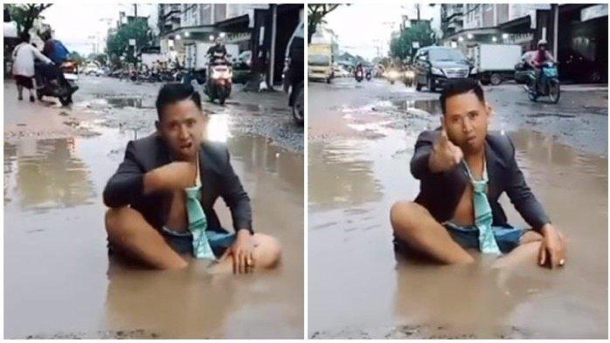 Viral pria di Palembang protes jalan rusak bekas galian IPAL di Palembang.