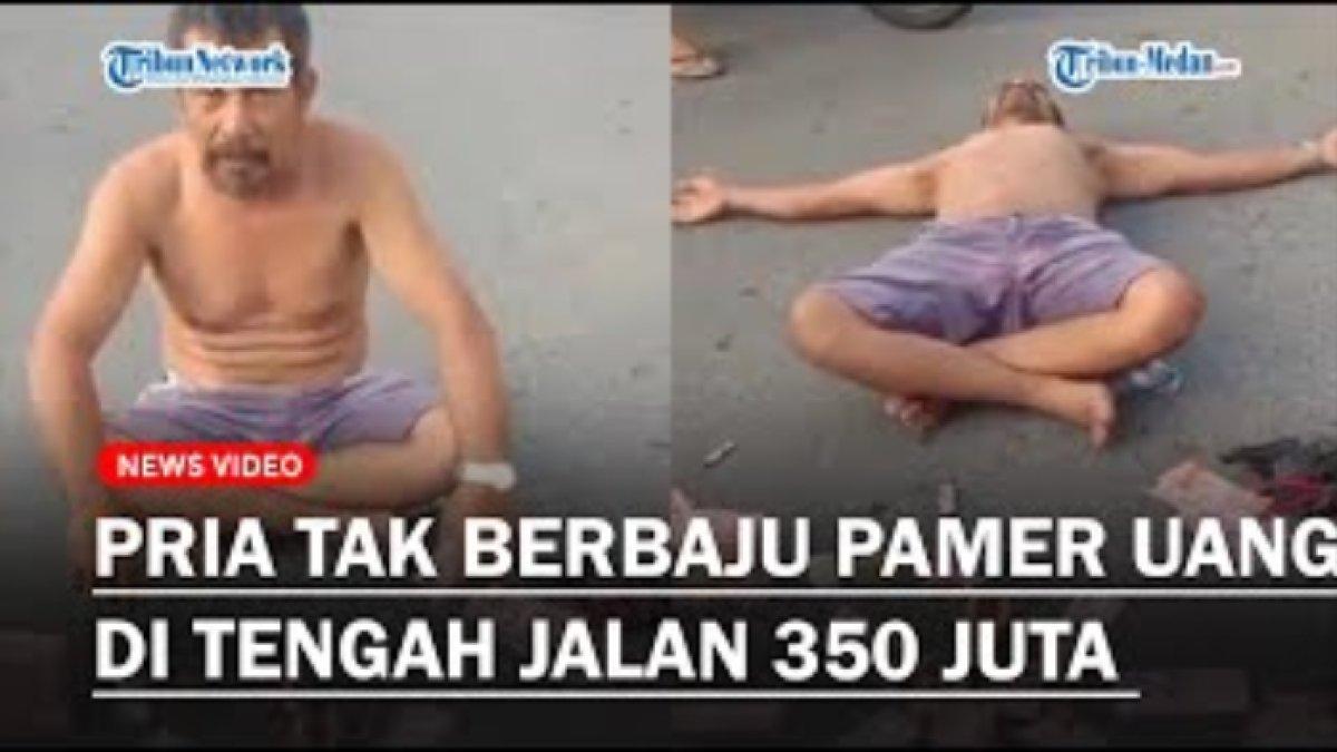 Viral! pria tajir pamer uang Rp 350 juta, ditumpuk di tengah jalan di Tapanuli sambil menantang diduga depresi.