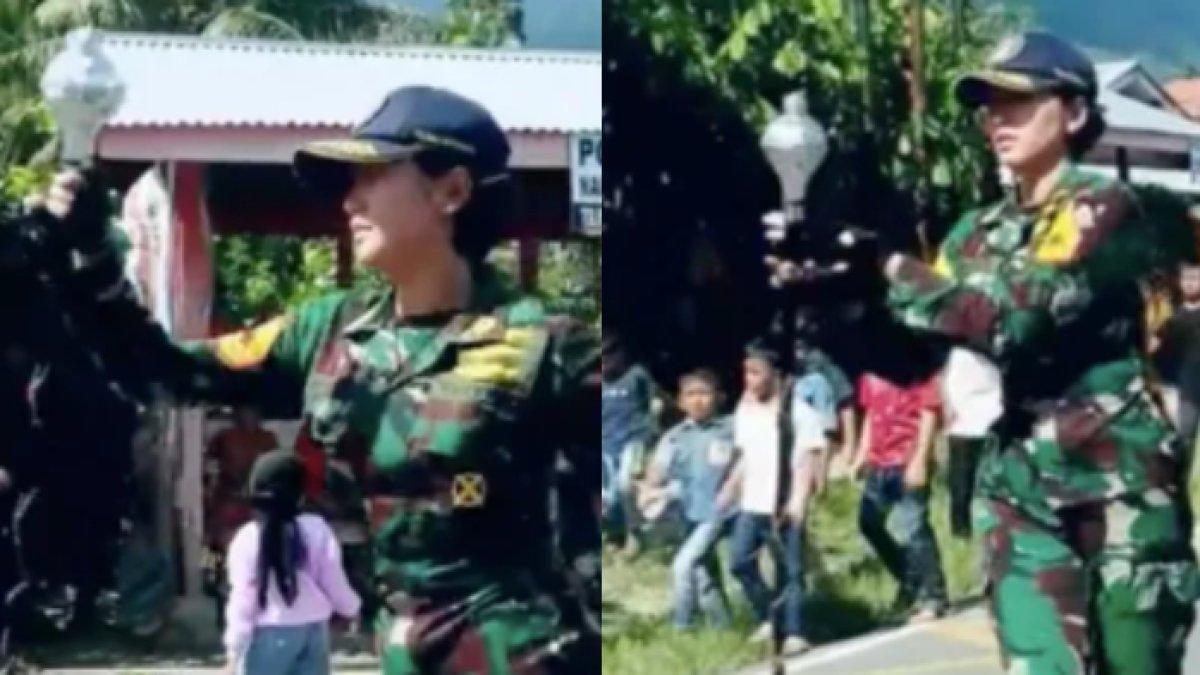 Sherly mengenakan seragam loreng TNI
