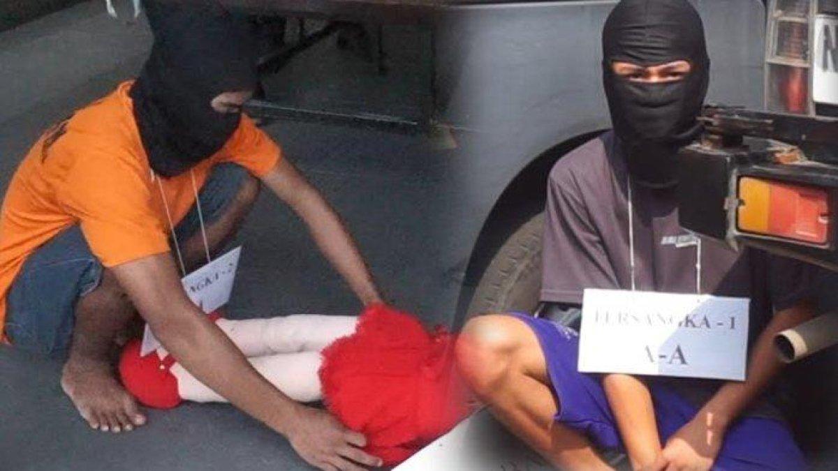 Tersangka AB (15) dan tersangka MA (19) menjalani reka ulang adegan pembunuhan siswi SMPN Kemlagi di Mapolres Mojokerto