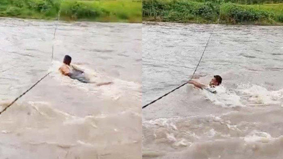 warga sebrangi sungai banjir.