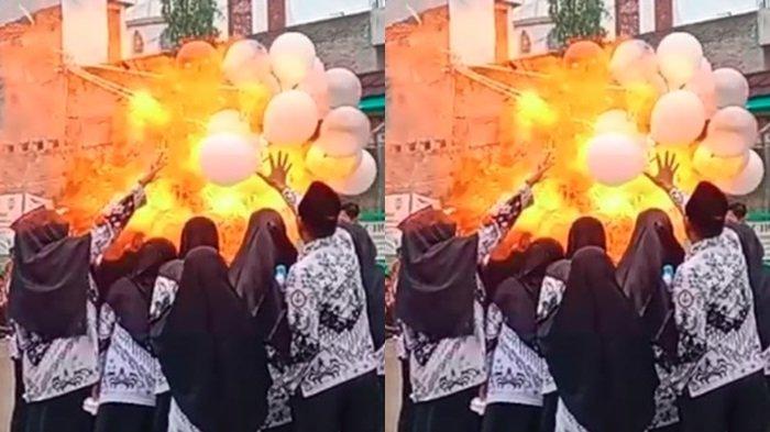 Detik-detik sejumlah guru berkerumun sembari memegang beberapa balon gas