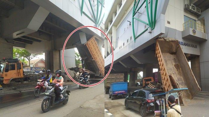 Bak dump truk tersangkut di stasiun LRT Asrama Haji Palembang, Sabtu (23/12/2023).