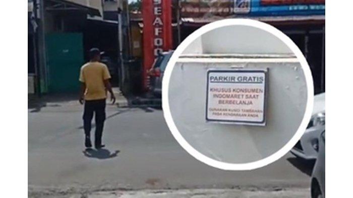 Ilustrasi: Aksi seorang laki-laki melepas kertas penutup penutup papan parkir gratis di depan minimarket.