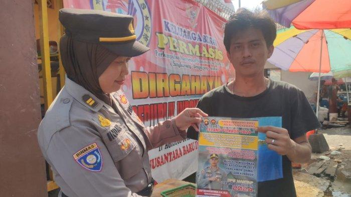 Kasat Binmas Polres Singkawang  IPTU Indah Sri Wilujeng, S.H sampaikan imbauan Pilkada Damai kepada Warga, Jumat 13 September 2024