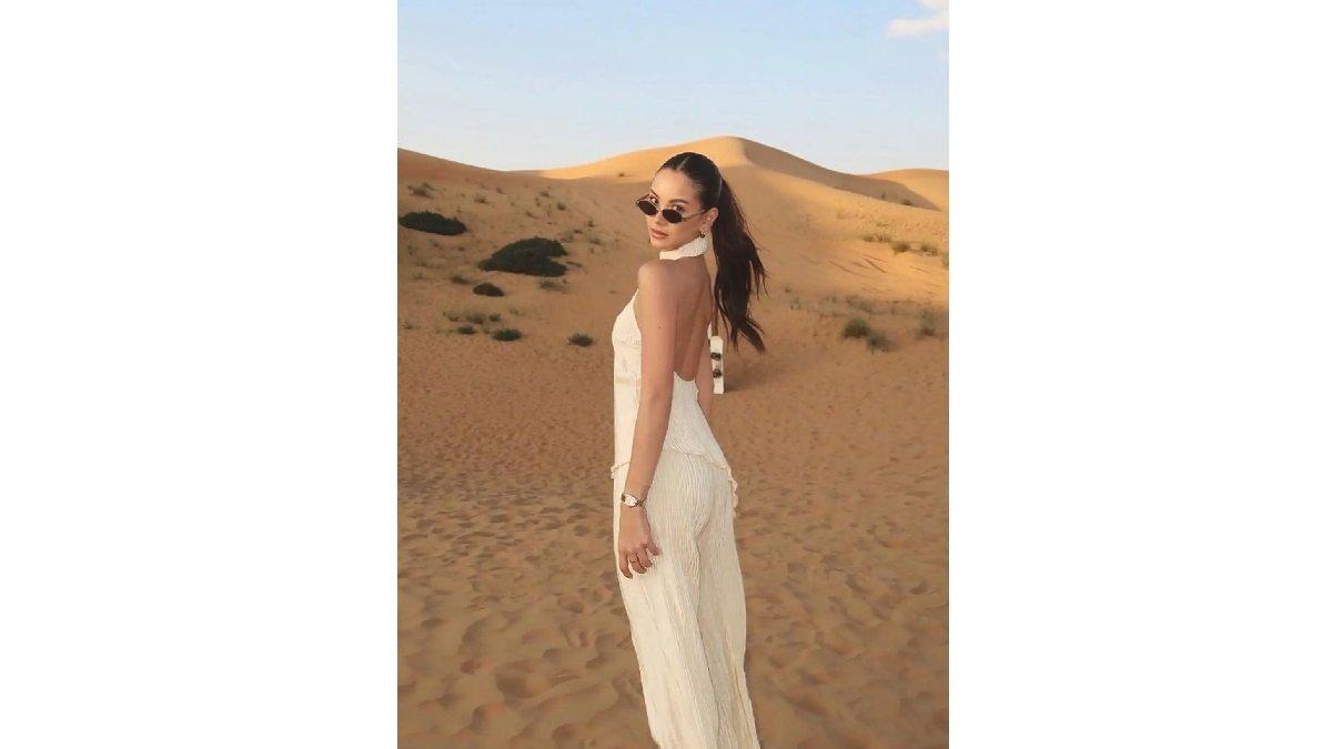 Gaya Alyssa Daguise mengenakan Setelan Putih dengan Atasan Hater Neck Sleeveless Model Backless.