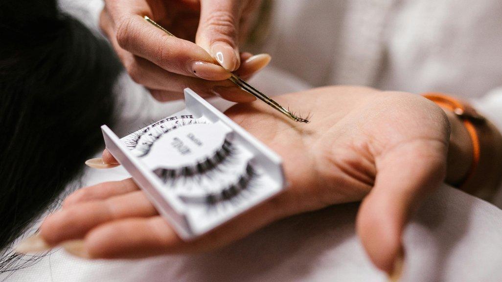 Applying fake lashes