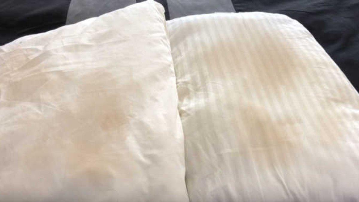 Ilustrasi sarung bantal yang kotor penuh noda termasuk air liur, keringat dan jamur.
