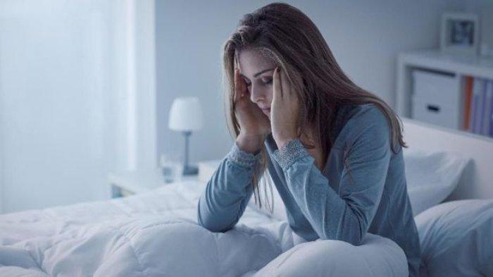 Ilustrasi wanita yang mengalami insomnia.
