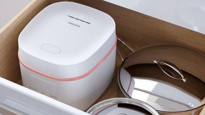 Ilustrasi PHILIPS 0.54L Mini Digital Rice Cooker HD3064/33 dengan desain ringkas.