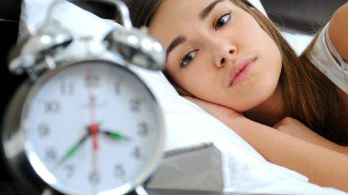 Ilustrasi wanita yang mengalami insomnia.