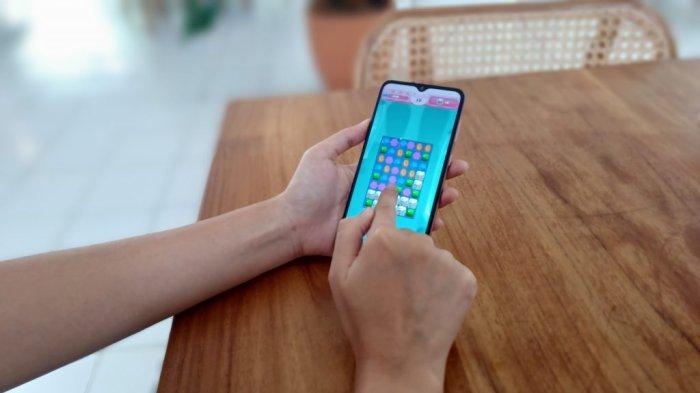Ilustrasi SAMSUNG Galaxy A04e dipakai untuk memainkan game ringan