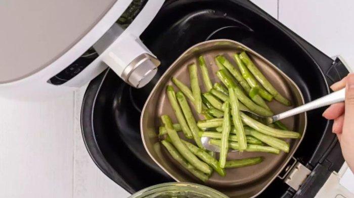 Ilustrasi memasak dengan air fryer.
