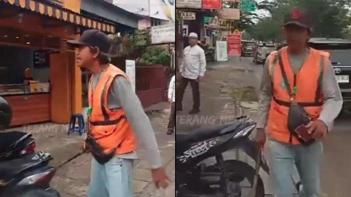Aksi tukang parkir menyerang driver ojek online (ojol) sambil membawa martil di Medan, Sumatra Utara, beredar viral.