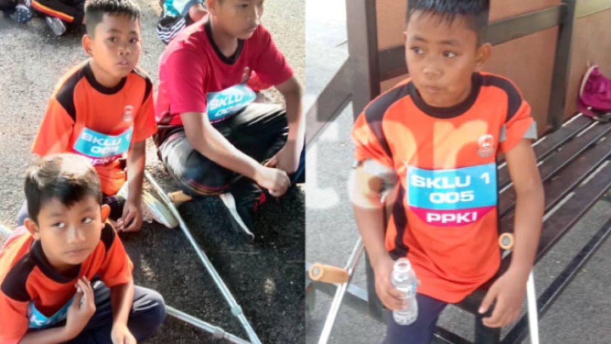 Aqil semangat ikut lomba lari dibantu tongkat