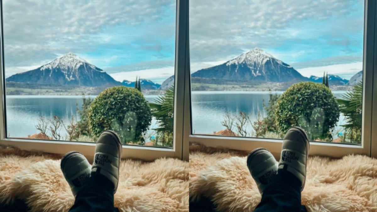 Ariel memamerkan potret kakinya dengan background pemandangan di Swiss