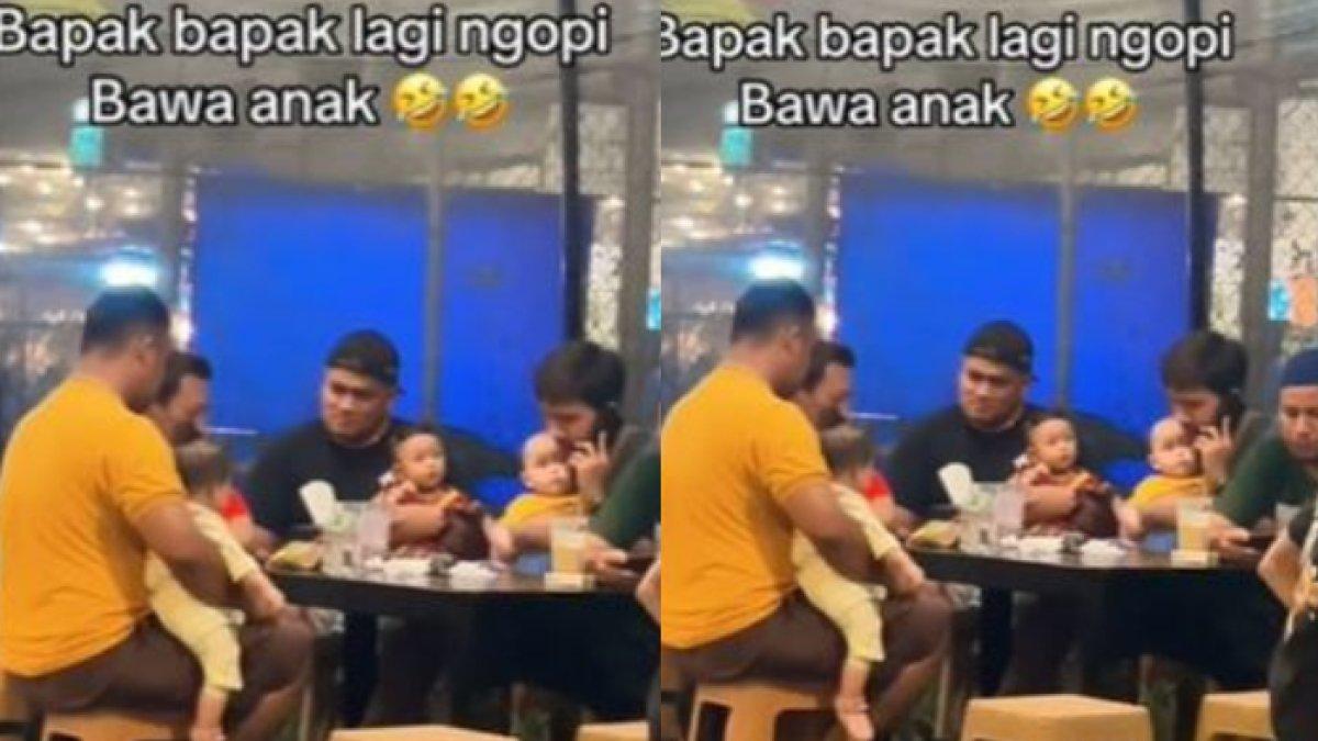 Bapak-bapak asyik nongkrong sambil momong anak
