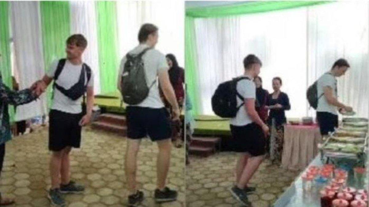 Beredar sebuah video yang memperlihatkan dua bule diajak makan di sebuah acara kondangan yang viral di media sosial.