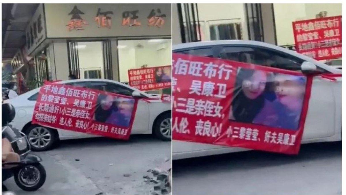 Di poster merah tercetak gambar Tuan Vu dan Nona Ly