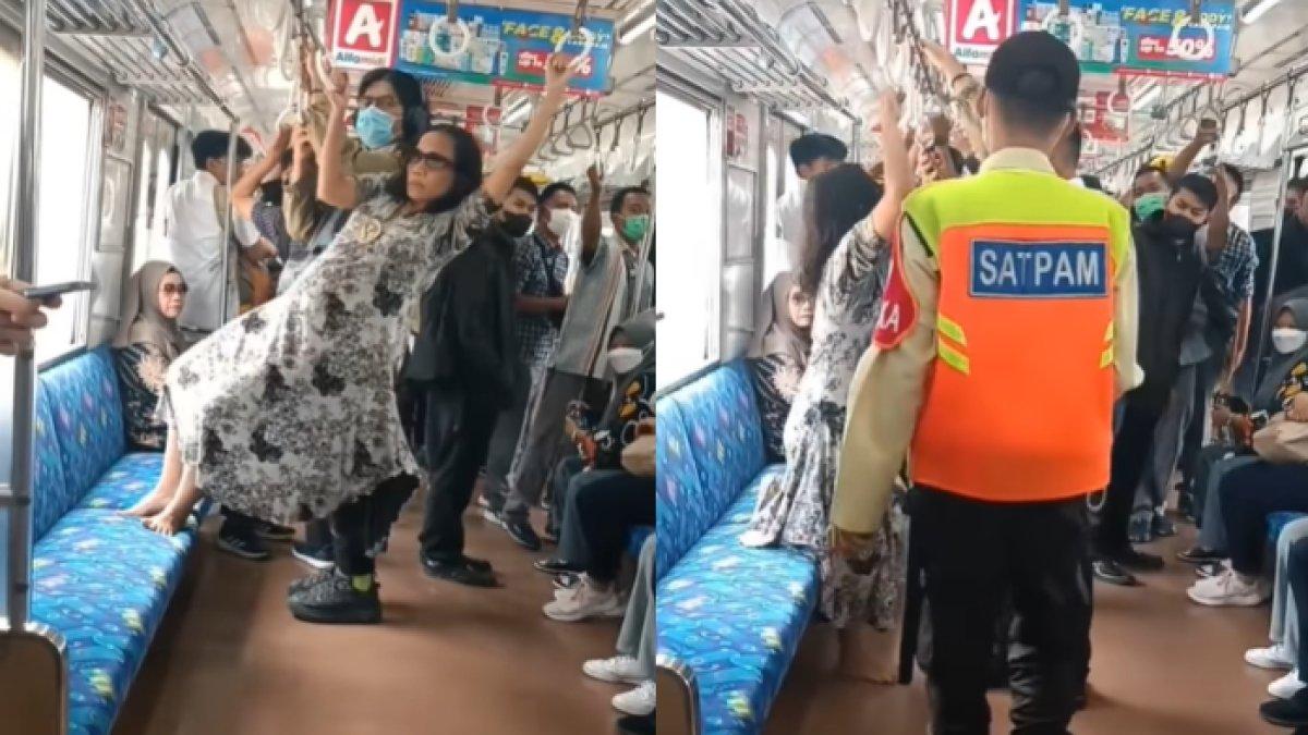 Emak-emak gelantungan di dalam KRL