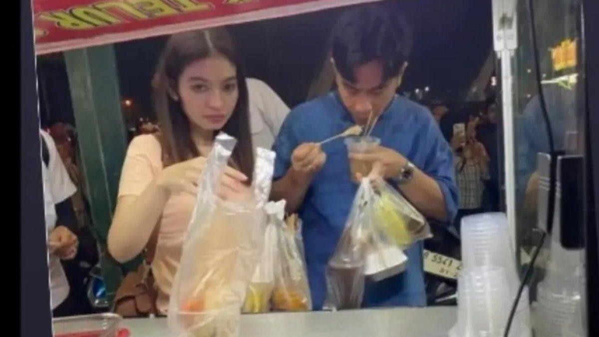 GIBRAN DAN SELVI ANANDA BORONG JAJANAN - Gibran Rakabuming terlihat memborong jajanan UMKM di sebuah bazar, ditemani sang istri, Selvi Ananda. 