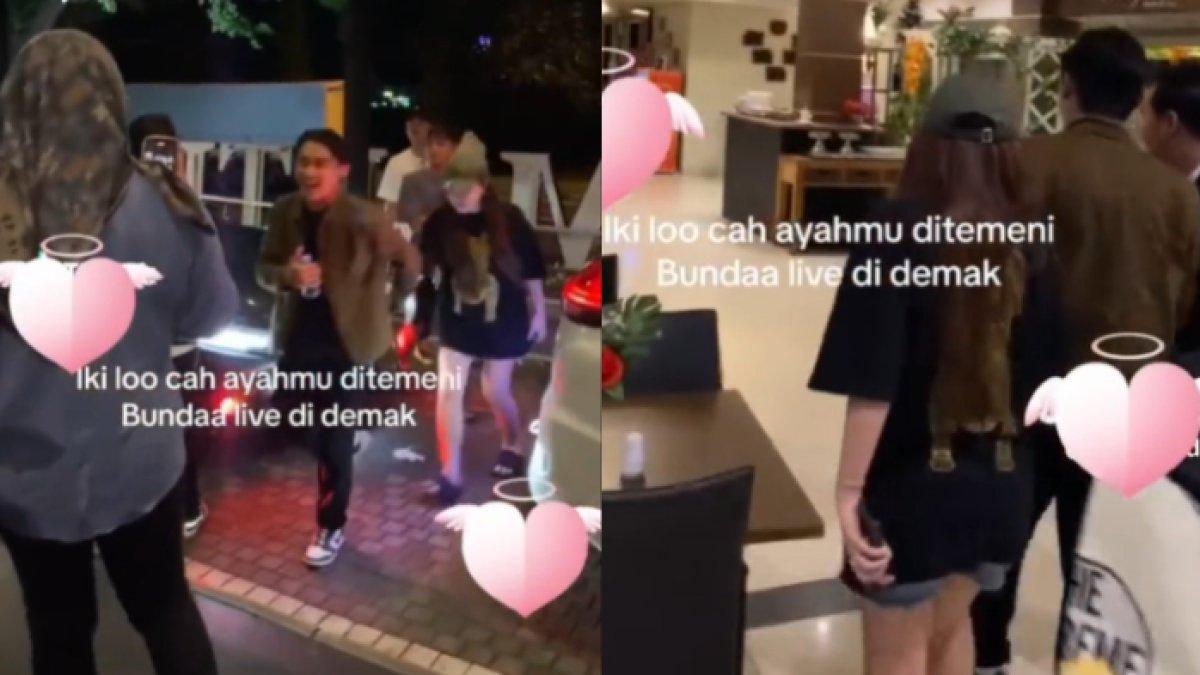 Gilga dan Happy berjalan menuju ke dalam hotel melewati kerumunan.