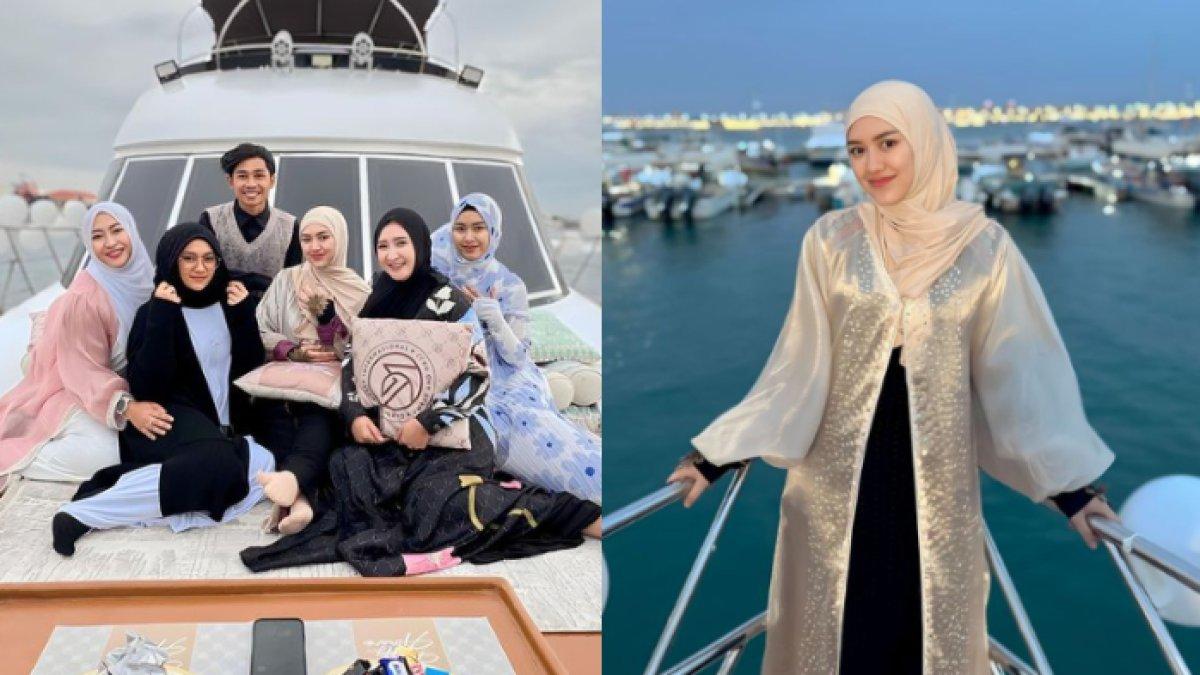 Happy dan rombongan juga terlihat menikmati suasana laut dengan menaiki kapal.