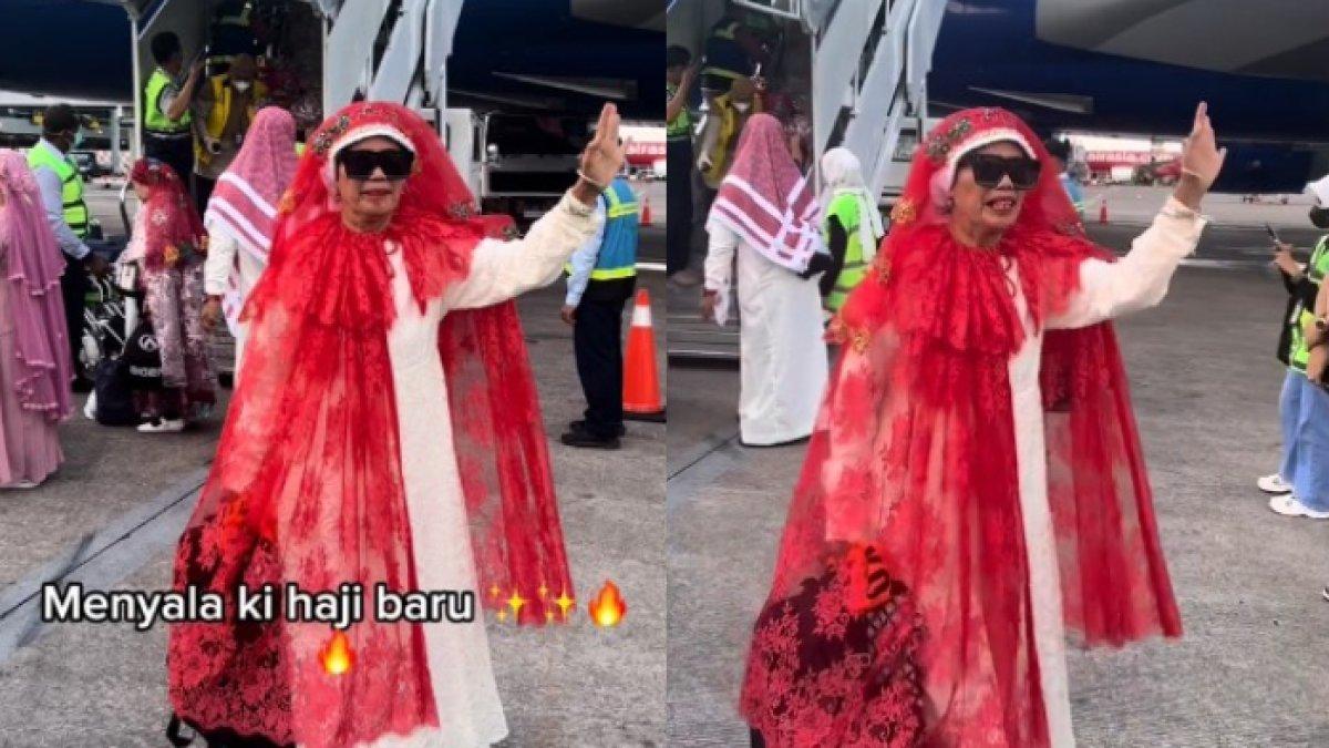 Jamaah haji pulang dengan busana meriah.