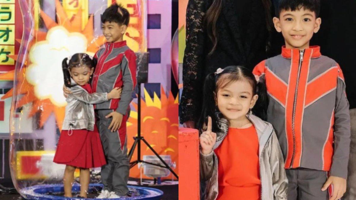 La Lembah Manah memakai dress warna merah yang dipadukan dengan jaket warna silver