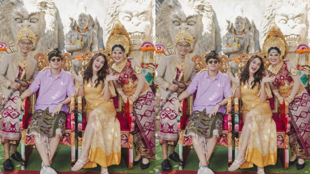 Luna Maya foto sambil duduk di kursi pengantin.