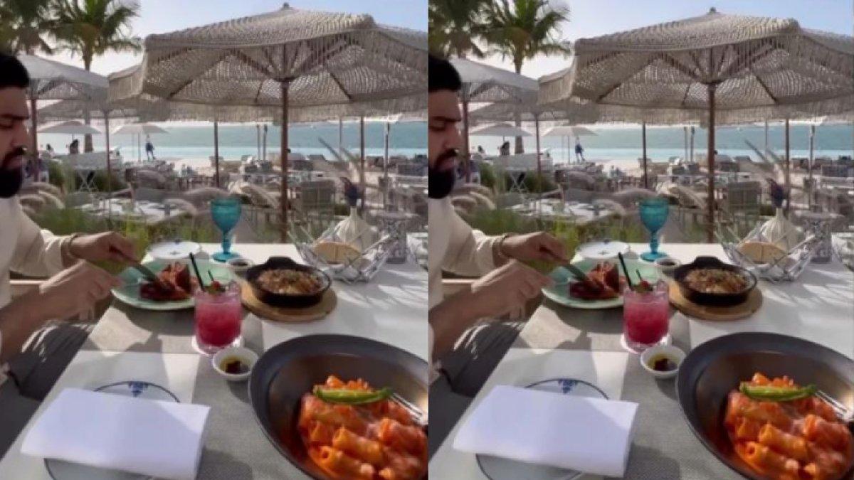 Malaikah Raja dan suami kaya rayanya sedang makan di pinggir pantai